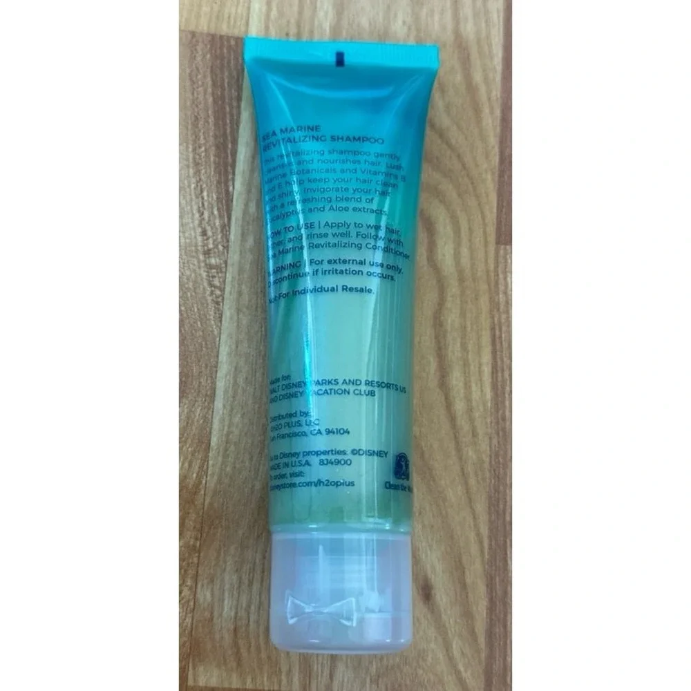 Disney H2O+ Beauty Sea Marine‎ Revitalizing Shampoo travel-size bottle.